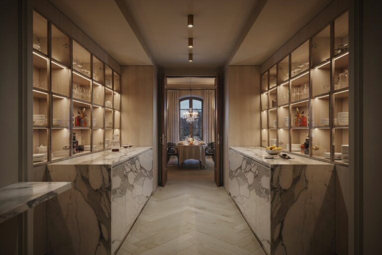 Walk Through Butlers Pantry Ideas: Corridor view toward glowing dining room